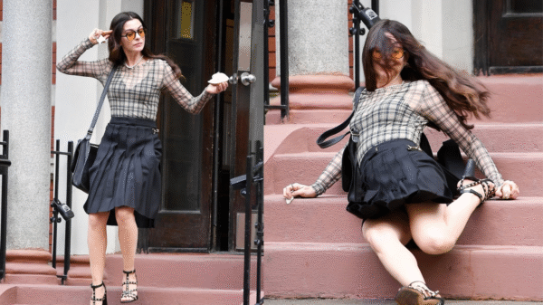 Anne Hathaway cai de escada durante gravação de 'O Diabo Veste Prada 2'; vídeo